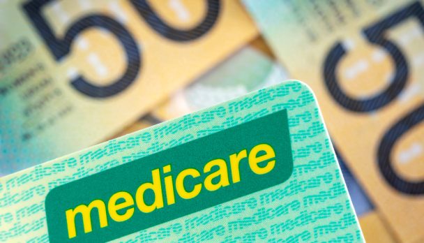 Australian,Medicare,Card,Over,Blurred,Money,Background.