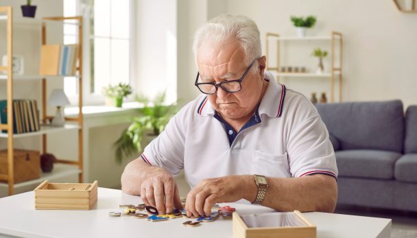 Portrait,Of,A,Senior,Elderly,Sad,Gray-haired,Man,Collecting,Wooden