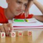 Child,Surrounded,By,Books,And,Notebooks,Frustrated,,With,The,Acronym