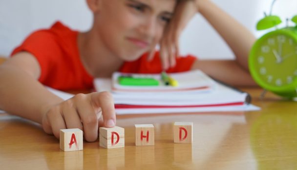 Child,Surrounded,By,Books,And,Notebooks,Frustrated,,With,The,Acronym